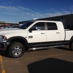 White truck with black bed liner coated wheel flare in Edmonton